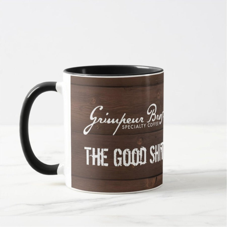 The_Good_Shit_SO_Coffee_Mug_Bundle_Wood_Panel_Mug_Handle_Left. GrimpeurBros.com's The Good Shit 1lb Single Origin Coffee and 11 oz Mug Bundle is comprised of a 1 lb bag of The Good Shit Single Origin Coffee - our current favorite Single Origin from our coffee line up, and a one The Good Shit 11 oz coffee mug. Good Morning Single Origin coffee is roasted on a weekly basis.