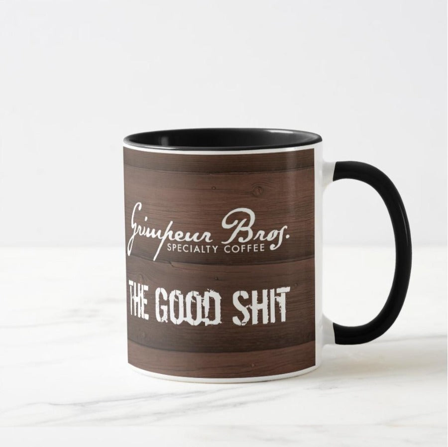 The_Good_Shit_SO_Coffee_Mug_Bundle_Wood_Panel_Mug_Handle_Right. GrimpeurBros.com's The Good Shit 1lb Single Origin Coffee and 11 oz Mug Bundle is comprised of a 1 lb bag of The Good Shit Single Origin Coffee - our current favorite Single Origin from our coffee line up, and a one The Good Shit 11 oz coffee mug. Good Morning Single Origin coffee is roasted on a weekly basis.